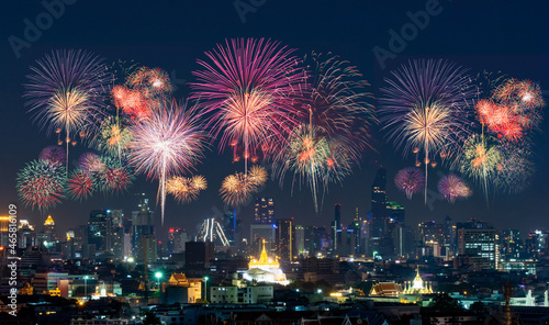 Firework with cityscape night light view of Thailand, Bangkok city skyline at twilight time, public scene from view point at the rooftop of tower.