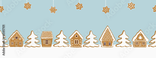 Christmas background. Gingerbread village. Seamless border. Fairytale winter landscape. There are gingerbread houses, stars and fir trees on a blue background. Vector illustration