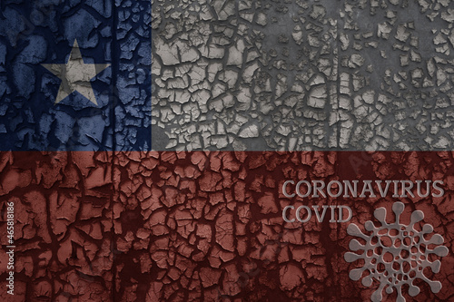 flag of chile on a old metal rusty cracked wall with text coronavirus, covid, and virus picture.