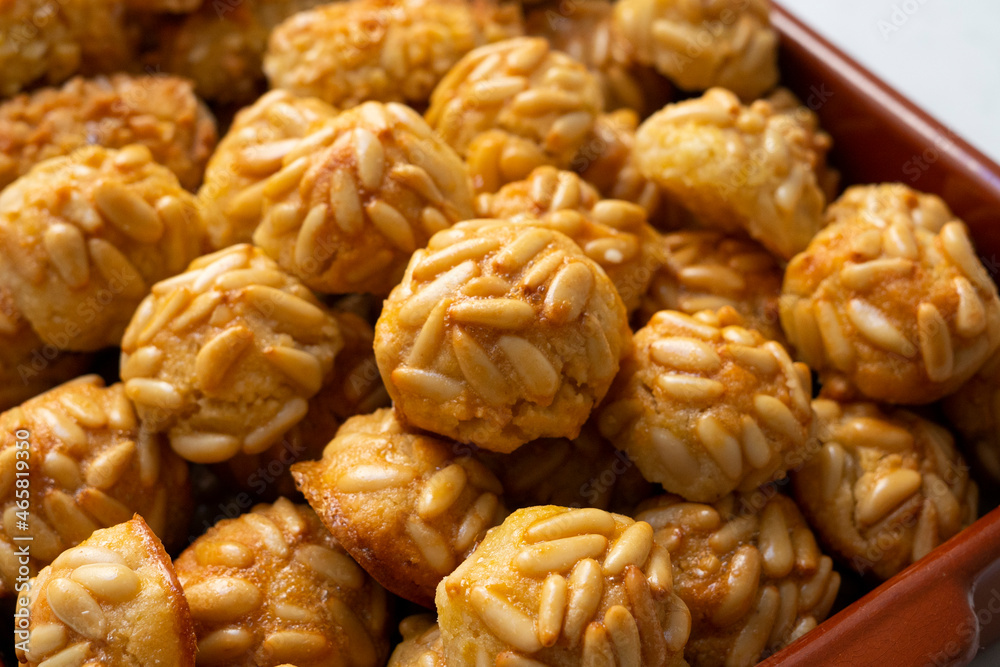 Panellets, traditional sweet dessert from Barcelona and Valencia made with potato, eggs, sugar and different nuts like almonds or pinions. Panellets, traditional sweet dessert from Barcelona and Valencia made with potato, eggs, sugar and different nuts like almonds or pinions.
