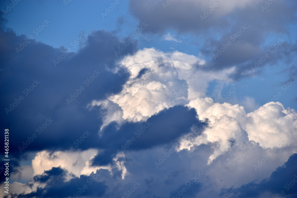 Blue and white cumulus storm clouds thunderstorm landscape