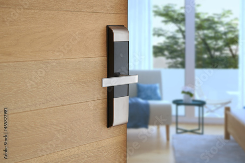 Digital Door handle or Electronics knob  for access to room security, Door wooden half opening through interior living room background, selective focus                     