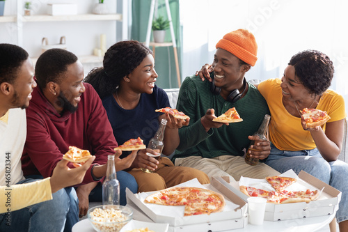 Group of african american millennials throwing home party