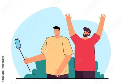 Friends making selfie photo with camera in mobile phone. Male characters using stick device flat vector illustration. Friendship, photography concept for banner, website design or landing web page