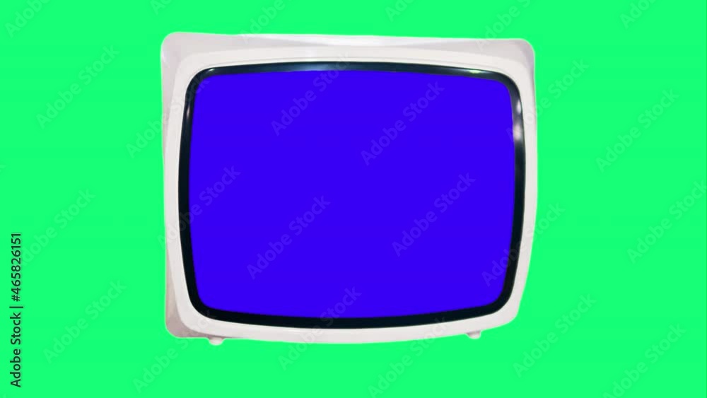 Chroma key Blue screen TV set for composition. Antique white TV with a blue screen on a green