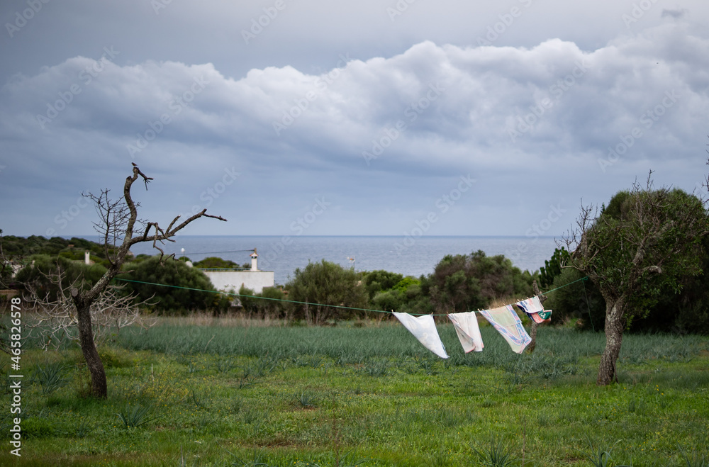 Linen drying outside next to the sea