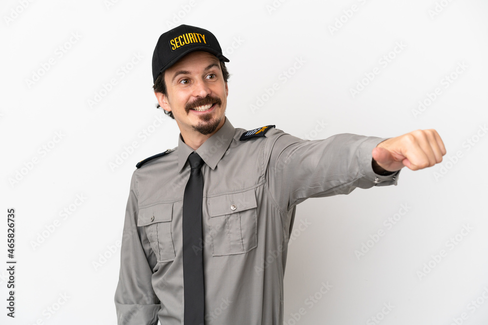 Young caucasian security man isolated on white background giving a thumbs up gesture