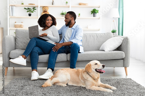 Wallpaper Mural Black couple at home using pc relaxing with dog Torontodigital.ca