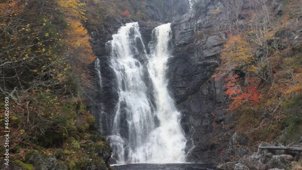 North River waterfalls, the highest waterfall of Nova Scotia Gushing water fall in an autumn forest landscape. North River Falls, Cape Breton, Nova Scotia, Canada North River waterfalls, the highest waterfall of Nova Scotia Gushing water fall in an autumn forest landscape. North River Falls, Cape Breton, Nova Scotia, Canada