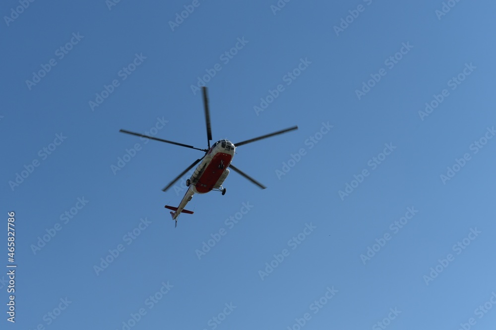 MI-8 regular helicopter in the blue sky MI-8 regular helicopter in the blue sky