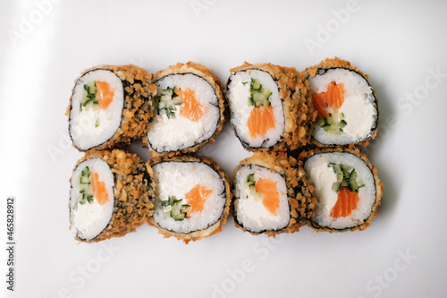 Sushi roll with salmon. Traditional Japanese cuisine side view.