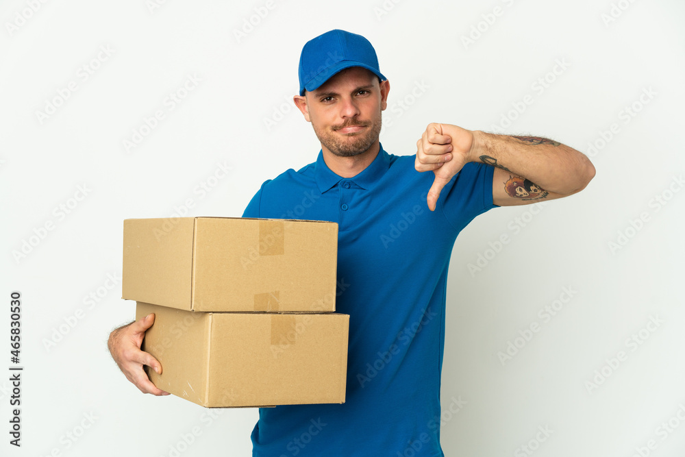 Delivery caucasian man isolated on white background showing thumb down with negative expression Delivery caucasian man isolated on white background showing thumb down with negative expression