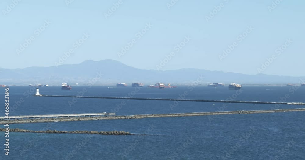 Sailboats and cargo ships at the Port of Los Angeles on a beautiful summer day
Sailboats and cargo ships at the Port of Los Angeles on a beautiful summer day