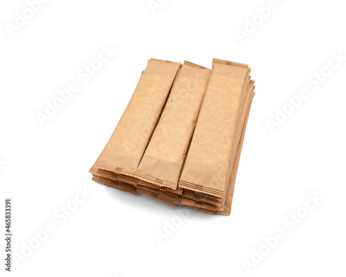Eco-friendly wooden disposable cutlery. Fork, spoon and napkin in a craft envelope on a white background.