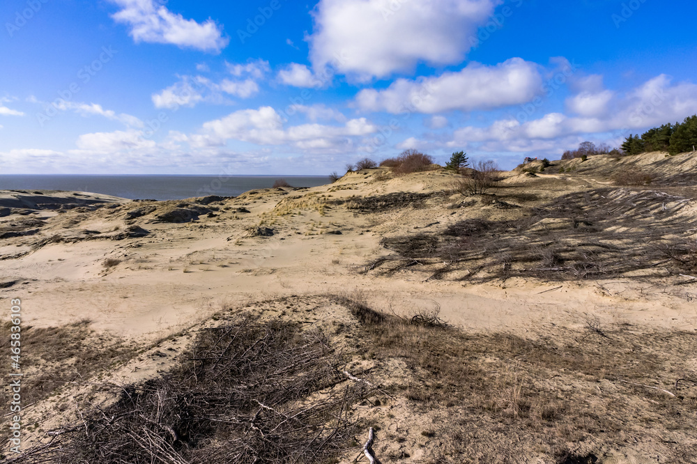 High sand dunes. Picturesque sea shores. Curonian Spit on the Baltic Sea. High sand dunes. Picturesque sea shores. Curonian Spit on the Baltic Sea.