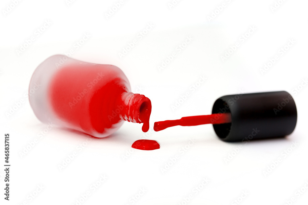 Set of multi-colored nail polish on a white background. Long banner. Manicure and pedicure selection of any colors. Liquid flows from the vial. Set of multi-colored nail polish on a white background. Long banner. Manicure and pedicure selection of any colors. Liquid flows from the vial.