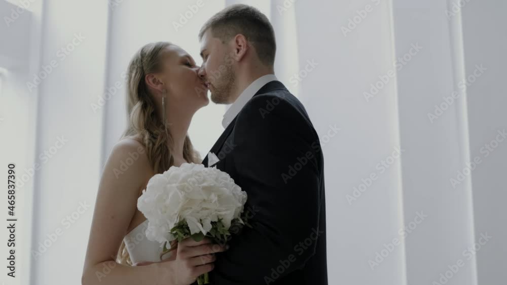 a young couple in love is basking having fun and kissing