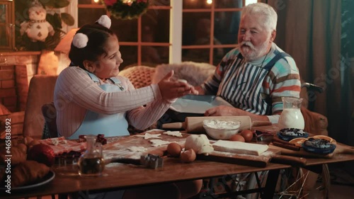 Wallpaper Mural Cute little girl helps her disabled grandfather to prepare cakes for Christmas and New Year Torontodigital.ca