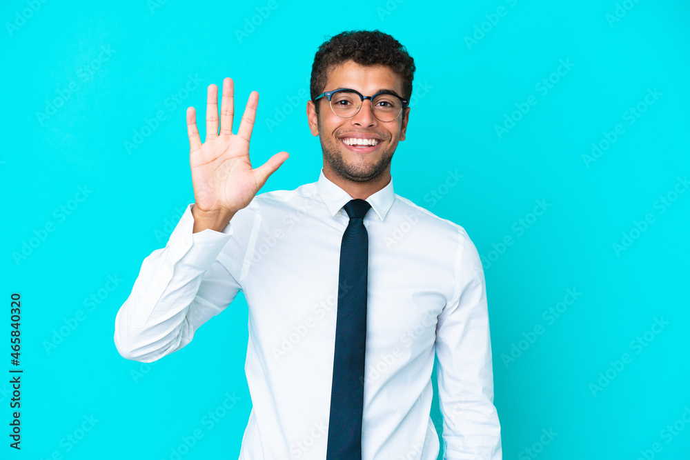 Young business Brazilian man isolated on blue background counting five with fingers Young business Brazilian man isolated on blue background counting five with fingers