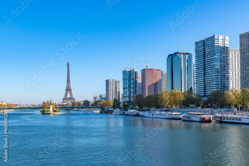 Paris, the Grenelle bridge , with the liberty statue, and the Eiffel Tower in background photo