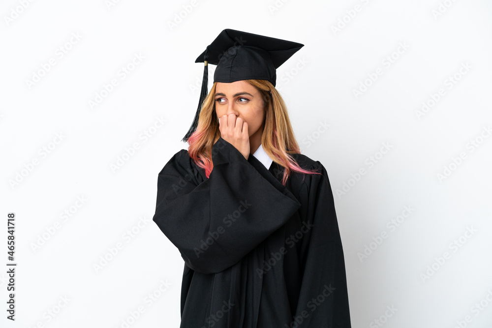 Young university graduate over isolated white background having doubts