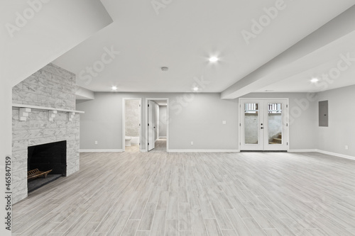 empty basement room with fireplace