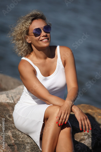 young woman by the sea in a white dress © zhagunov_a