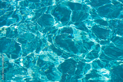 Fototapeta Naklejka Na Ścianę i Meble -  Abstract ripple wave and clear turquoise water surface in swimming pool, blue water wave for background and abstract design.