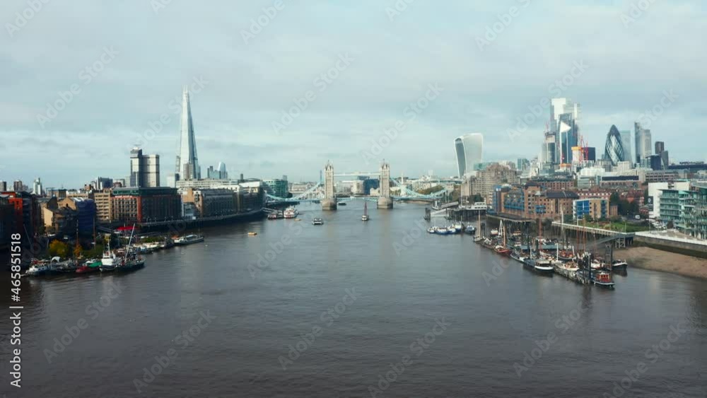 Aerial view to the Beautiful Tower Bridge and skyline of London, UK, just after sunset during cloudy weather. Aerial view to the Beautiful Tower Bridge and skyline of London, UK, just after sunset during cloudy weather.