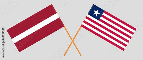 Crossed flags of Latvia and Liberia. Official colors. Correct proportion photo