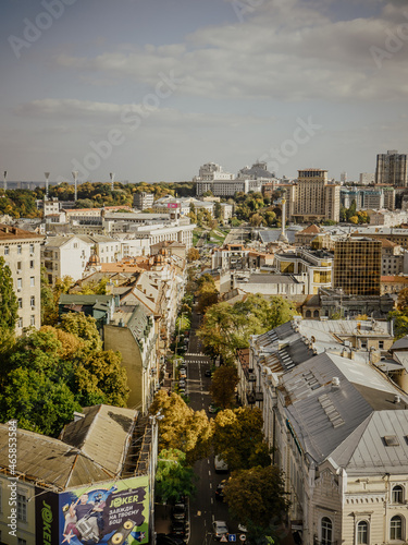 Autumn view of Kiev from the height of bird benefits. Architecture of ancient buildings and streets in the historic quarter of Kiev photo