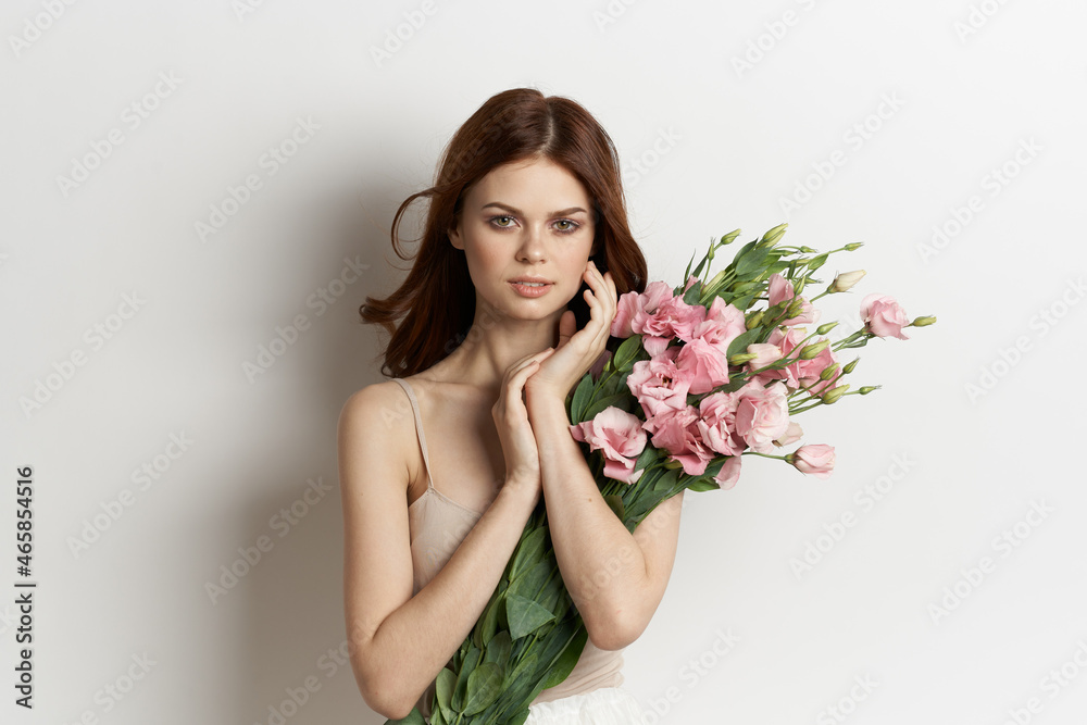 attractive woman in dress posing flowers makeup light background attractive woman in dress posing flowers makeup light background