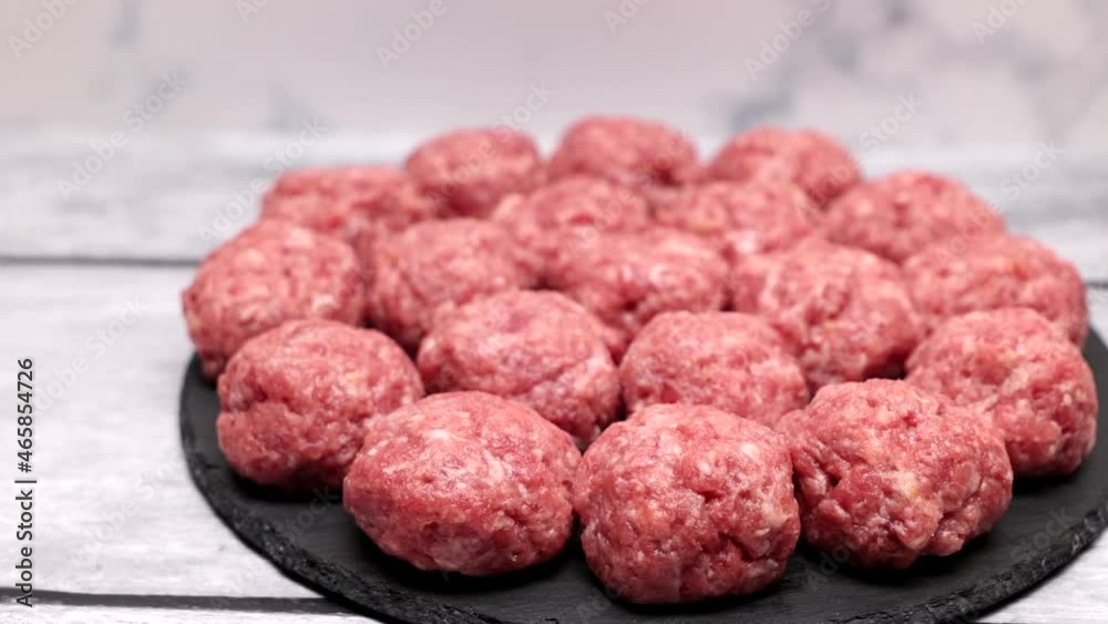 Homemade Minced Beef And Pork Cutlets, Meatballs, Nuggets, Kebab, Raw, On A Slate Tray. Dolly Slider Shot. Top View. Homemade Minced Beef And Pork Cutlets, Meatballs, Nuggets, Kebab, Raw, On A Slate Tray. Dolly Slider Shot. Top View.