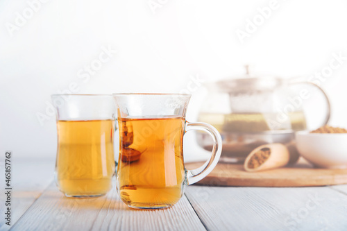 Superfood Taiwan Ku Qiao buckwheat tea in teapot and transparent cups close-up and copy space..