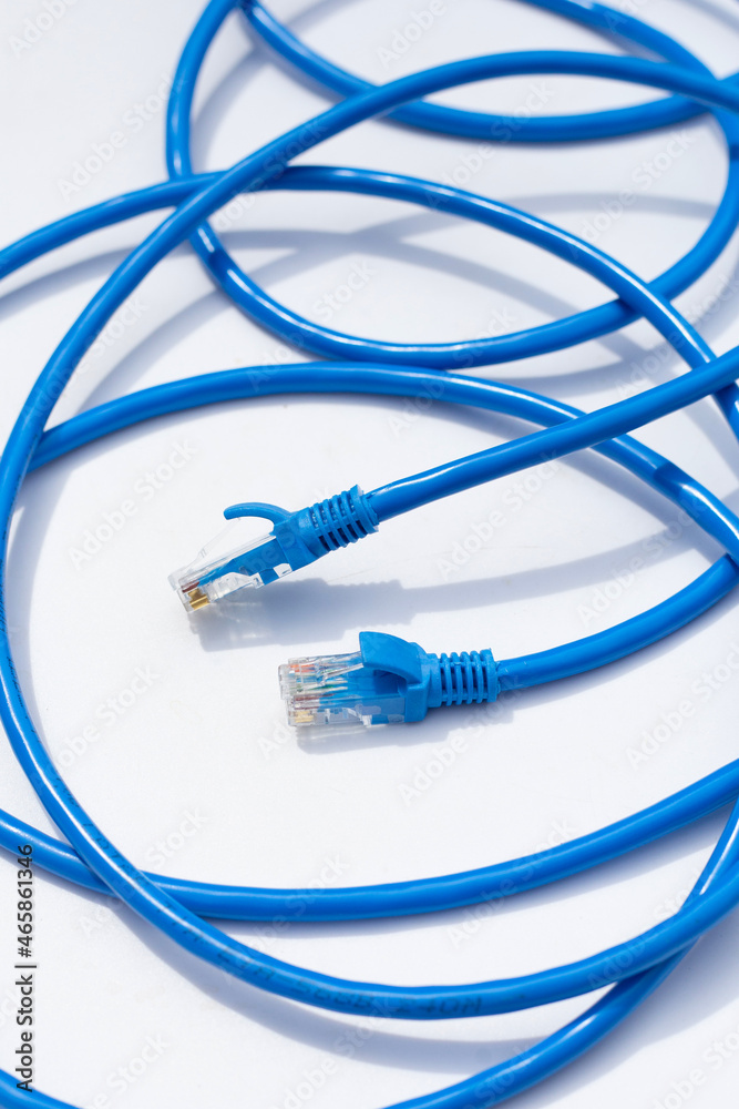 LAN network connection ethernet blue cables on white background. LAN network connection ethernet blue cables on white background.
