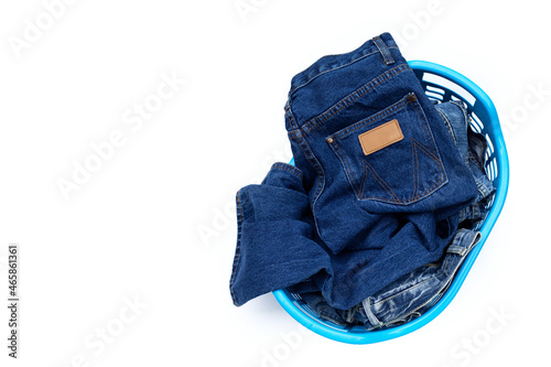 Jeans in laundry basket. Top view