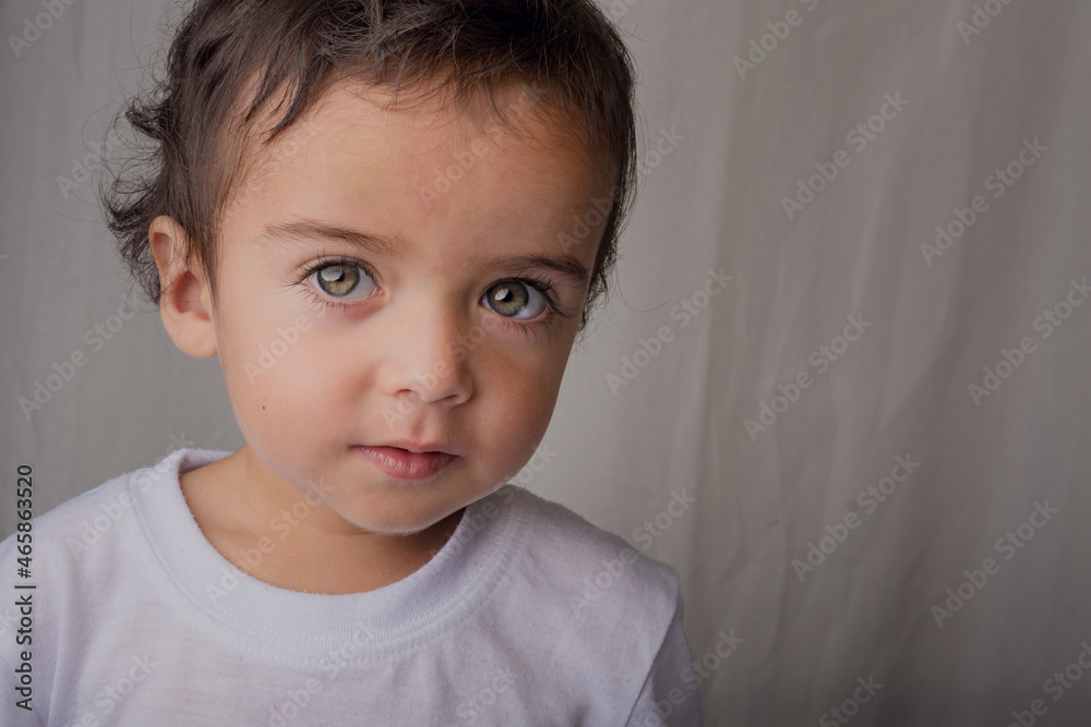 portrait of little boy with big expressive eyes portrait of little boy with big expressive eyes