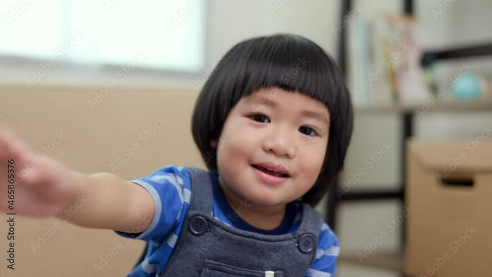 Positive little boy smiling looking at camera at home, cute kid talking to webcam making online video call or recording vlog having fun Positive little boy smiling looking at camera at home, cute kid talking to webcam making online video call or recording vlog having fun