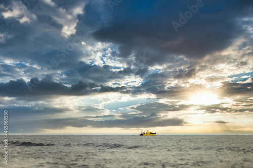 Tourists sail on a boat looking for a southern right whale in Valdes Peninsula