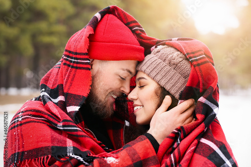 Happy young couple in fores...