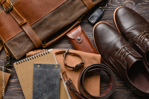 Set of stylish male accessories on wooden background