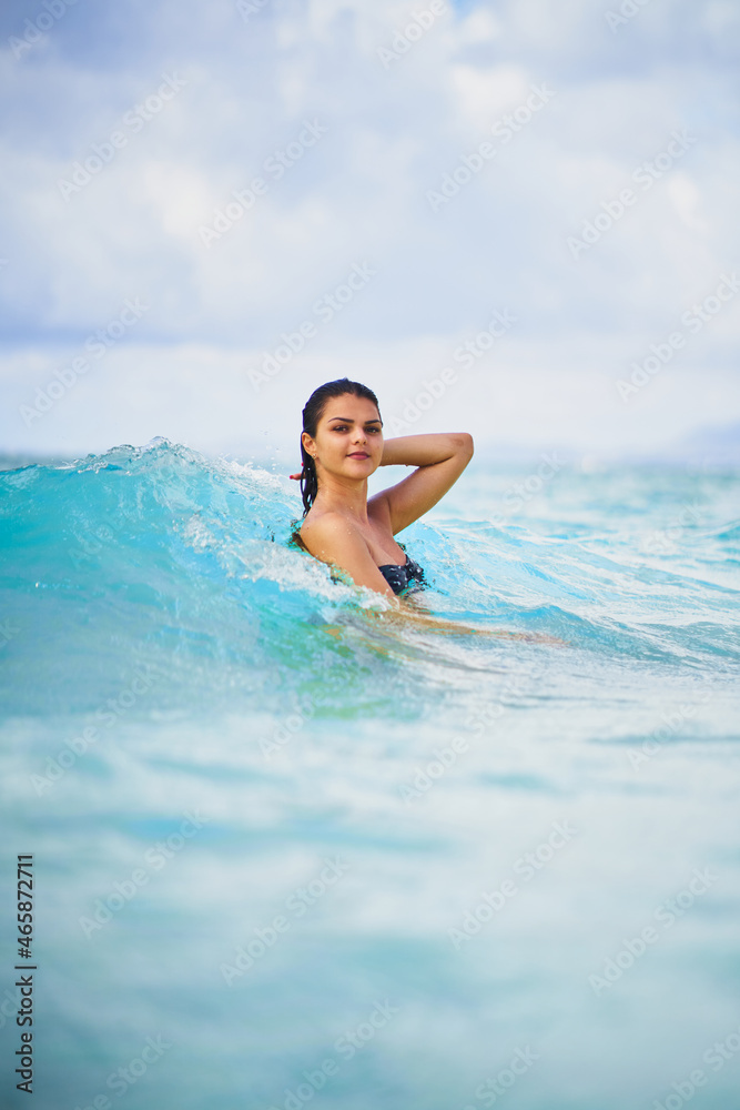 Charming woman swimming in clean sea