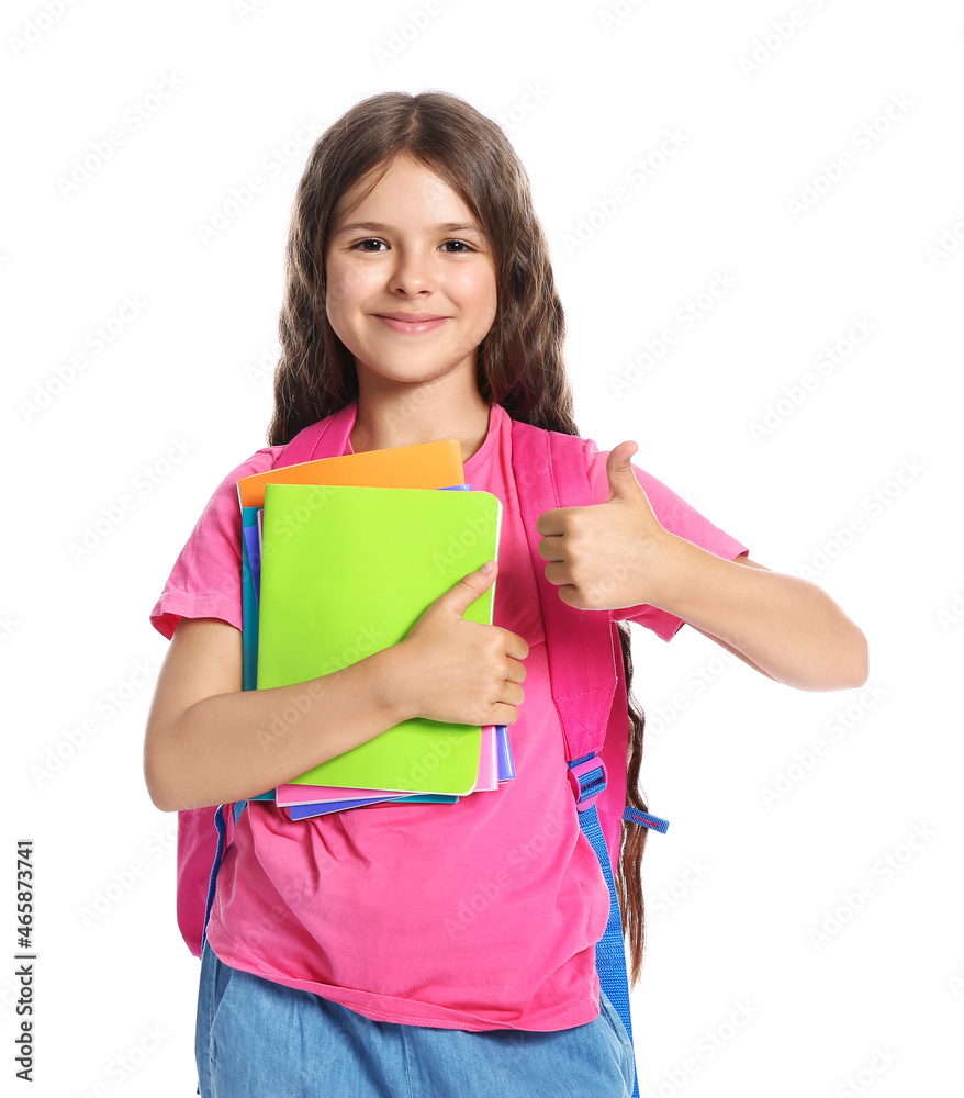 Little schoolgirl showing thumb-up, isolated on white Little schoolgirl showing thumb-up, isolated on white