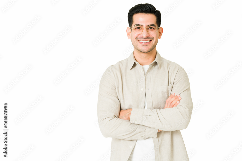 Cheerful young man with his arms crossed Cheerful young man with his arms crossed
