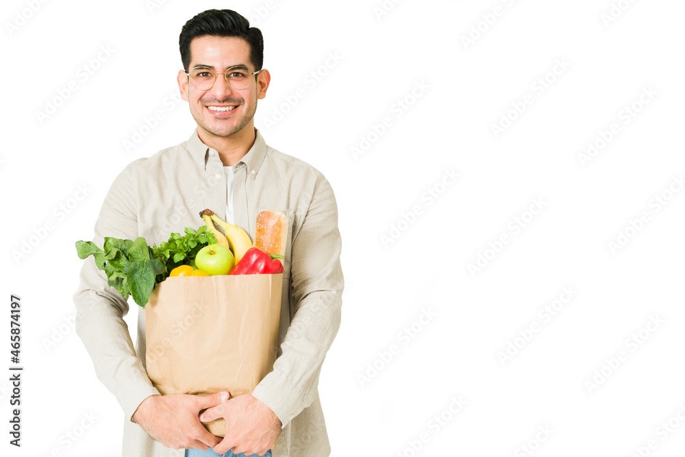 Attractive man going grocery shopping Attractive man going grocery shopping