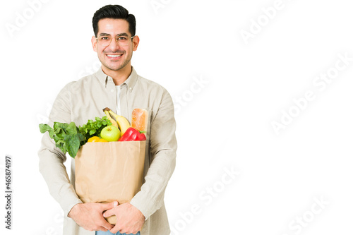 Attractive man going grocery shopping photo
