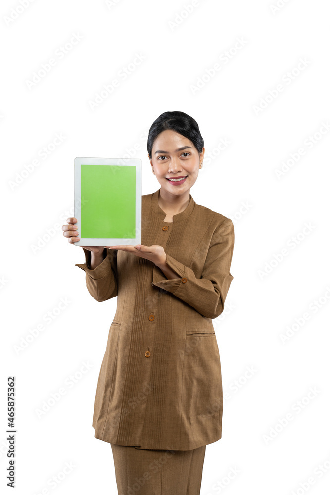 Attractive woman wearing khaki uniform smiling showing her tablet screen Attractive woman wearing khaki uniform smiling showing her tablet screen
