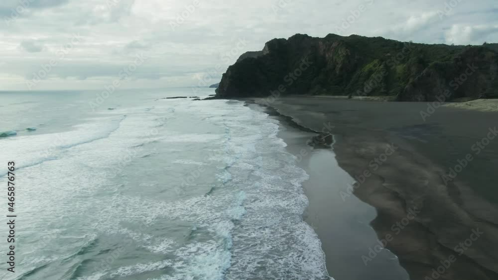 Aerial: Flying over waves and rocky coastline. Karekare, Auckland, New Zealand Aerial: Flying over waves and rocky coastline. Karekare, Auckland, New Zealand