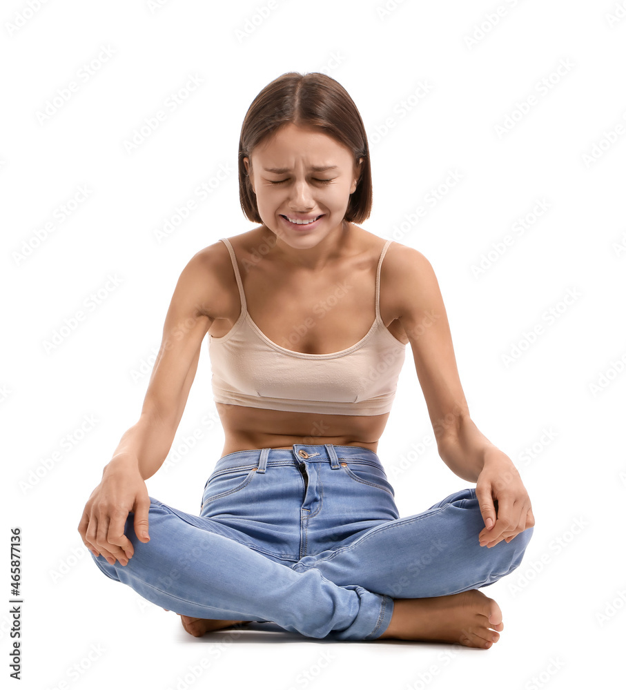 Young skinny woman on white background. Anorexia concept Young skinny woman on white background. Anorexia concept