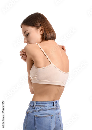 Young skinny woman on white...